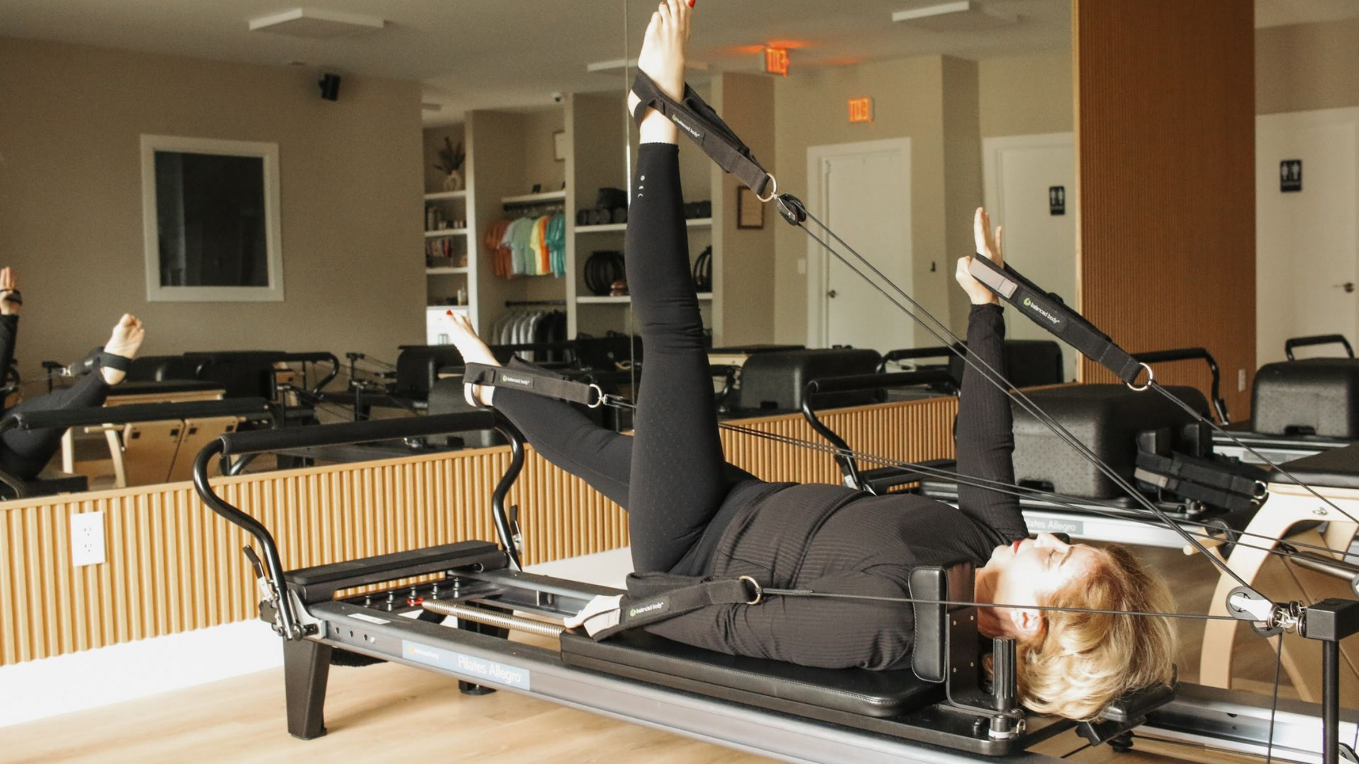 Pilates reformer exercise demonstrating flexibility and mobility at Pilates by Tammie