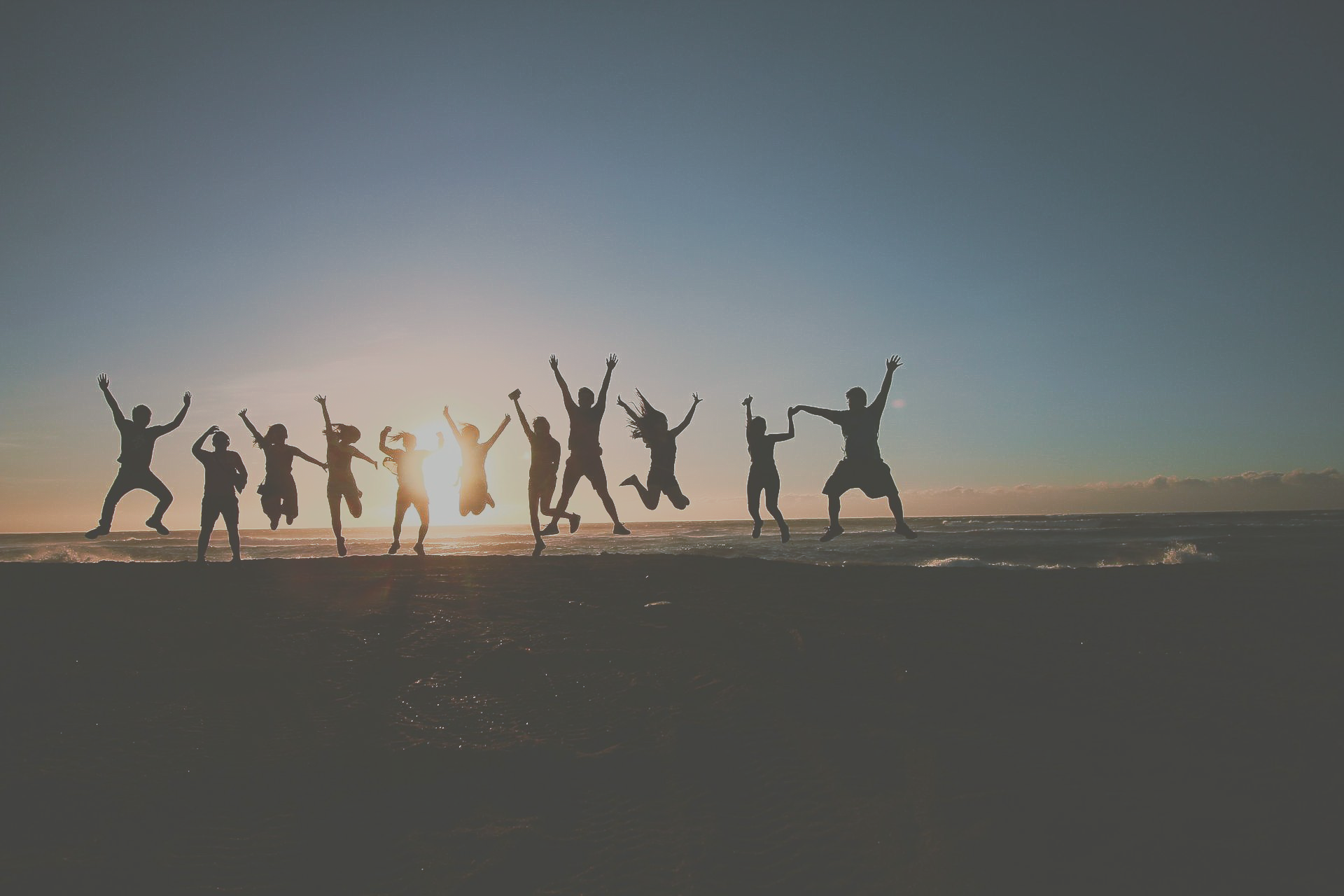Pilates community moving together at sunset, celebrating connection, strength, and new beginnings