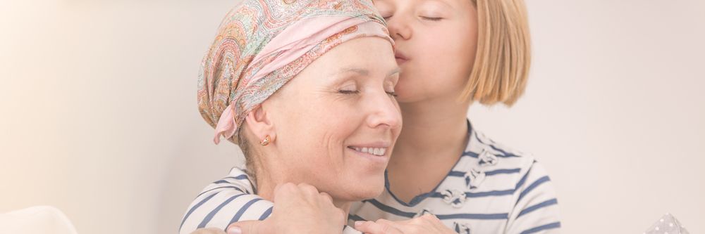 Girl hugging her ill mother with love