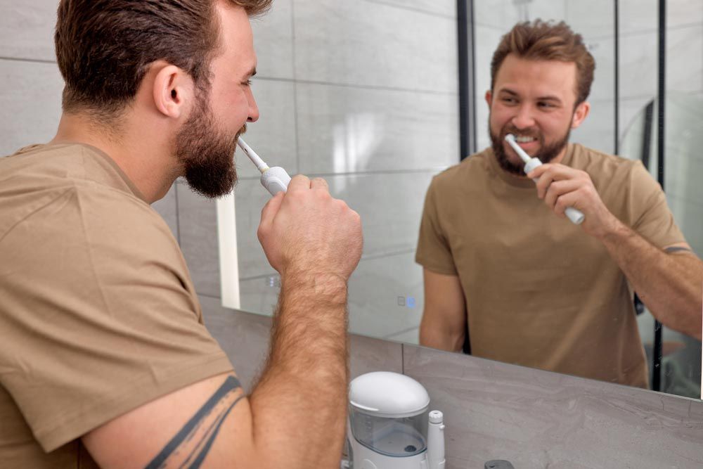 person brushing their teeth