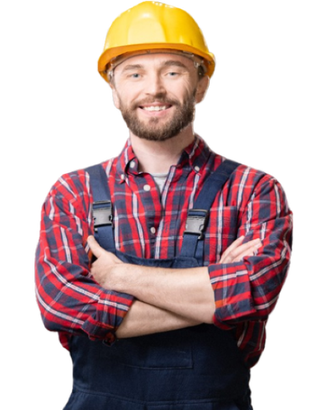 A man wearing a hard hat and plaid shirt is standing with his arms crossed.