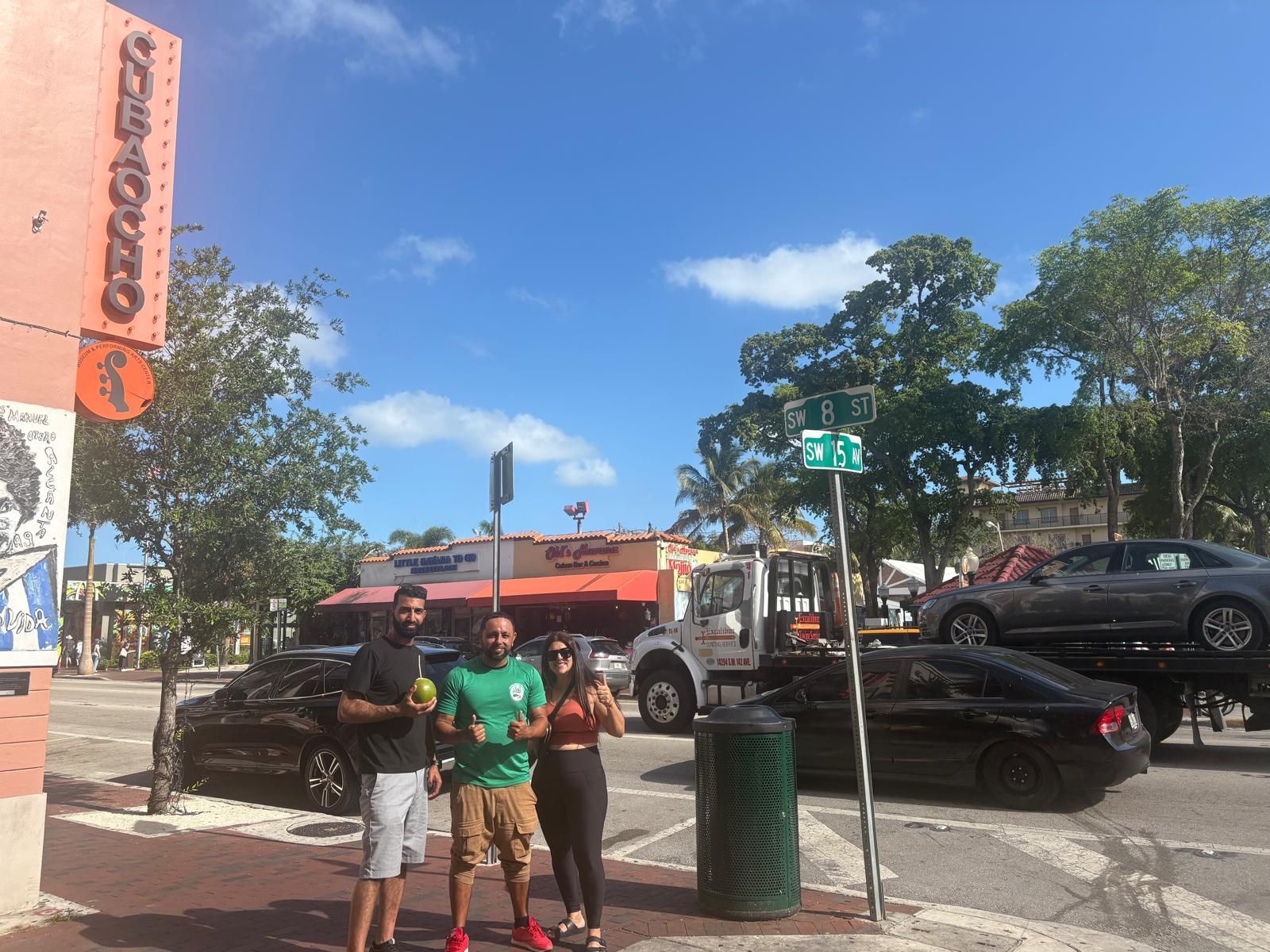 Miami tour bus passengers in little Havana with a coconut drink in hand with the Tour guide