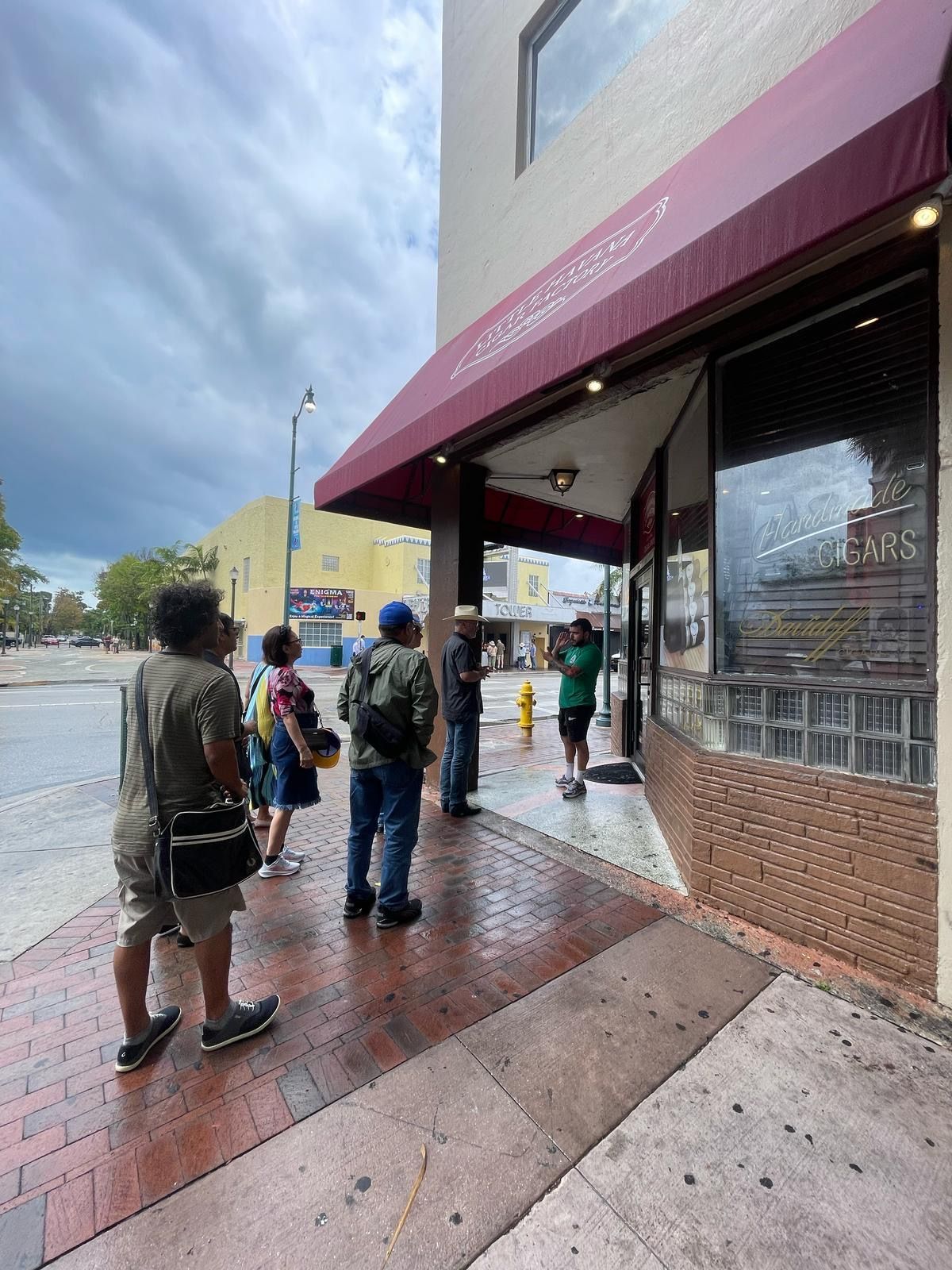 Miami tour guests visiting a local cigar shop during Little Havana bus tour experience
