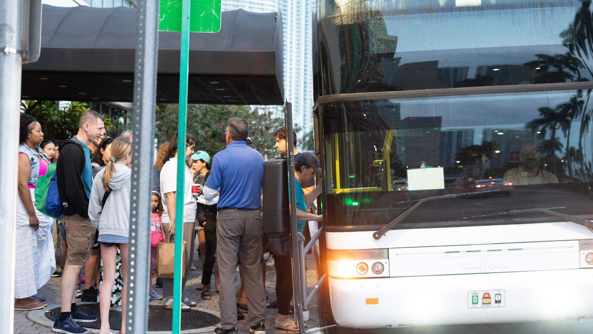 Guests boarding the Miami to Key West double-decker bus for a scenic Florida Keys tour
