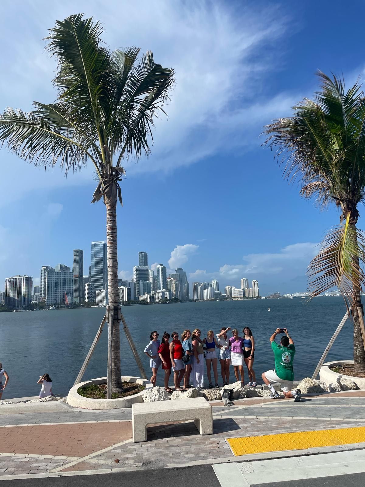 “Guests posing with big smiles at the secret Miami Skyline photo spot during the city tour”
