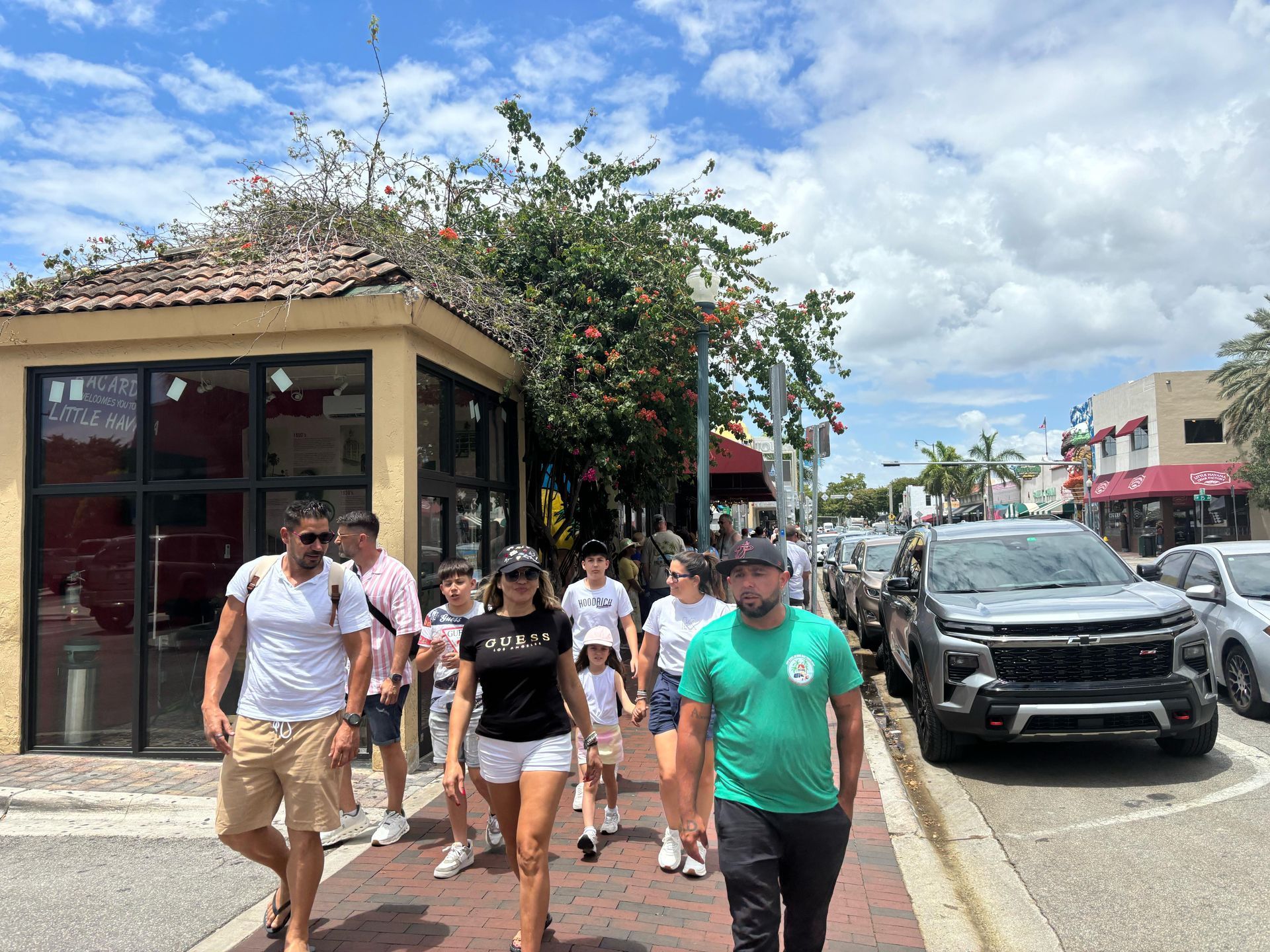 Little Havana Walking tour Miami Tour Bus tour guide walking with passengers on hop on hop off experience