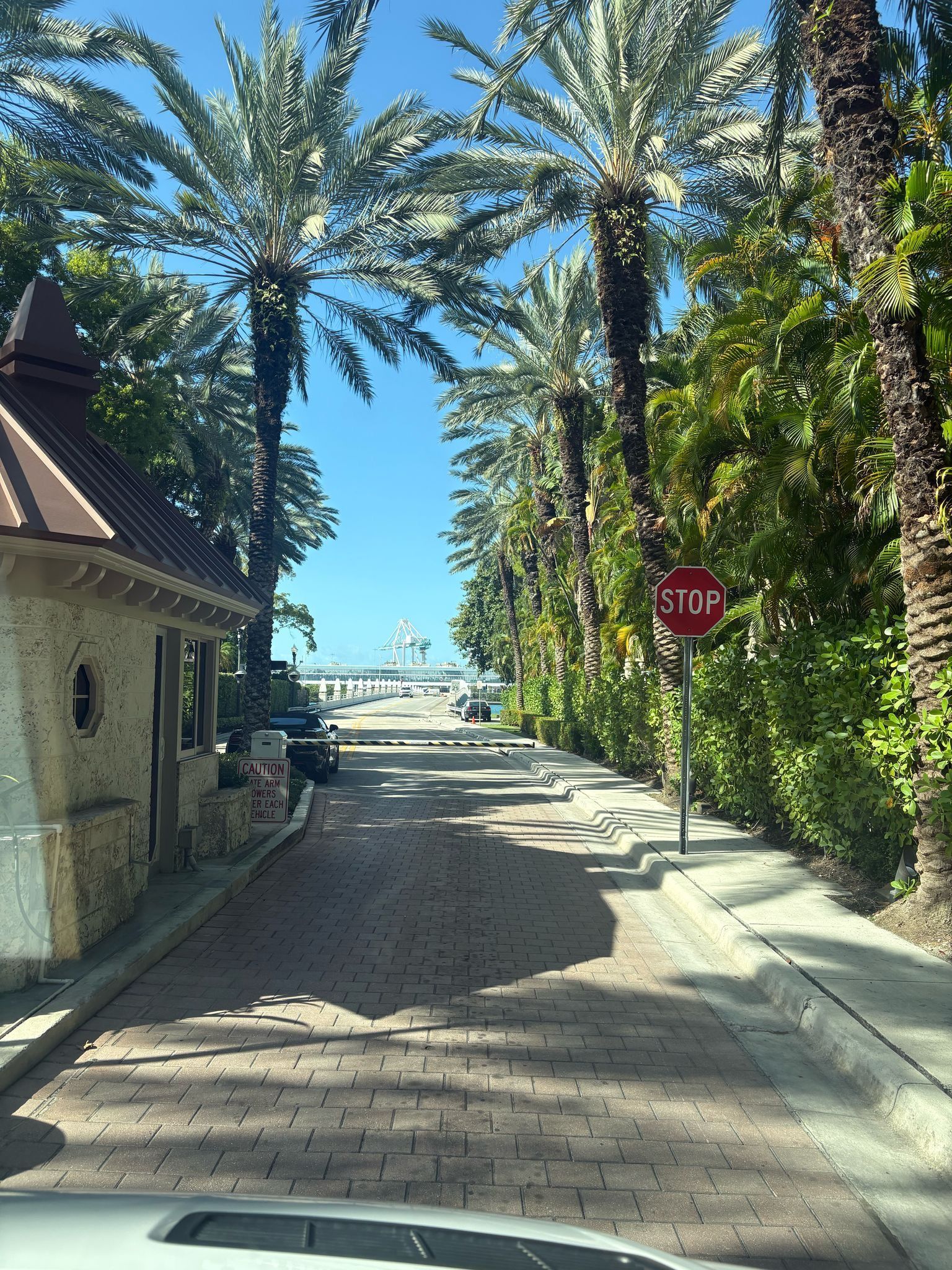 Security gate entrance to Star Island seen during a sightseeing Miami bus tour
