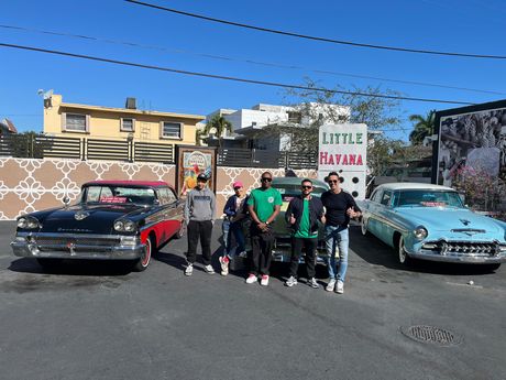 group photo of the Driver and Tour guide with passengers in little Havana on the walking tour on the Miami Sightseeing Bus Tour