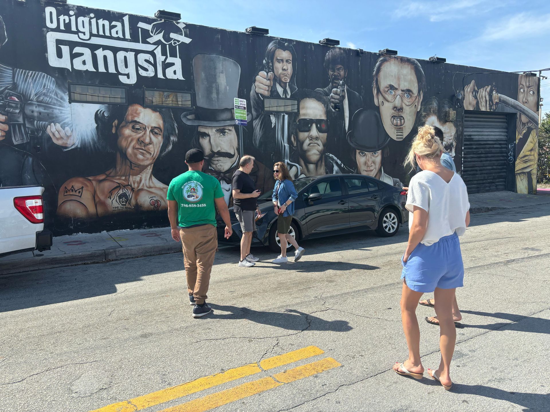 Tourist taking a selfie in front of Wynwood Walls
