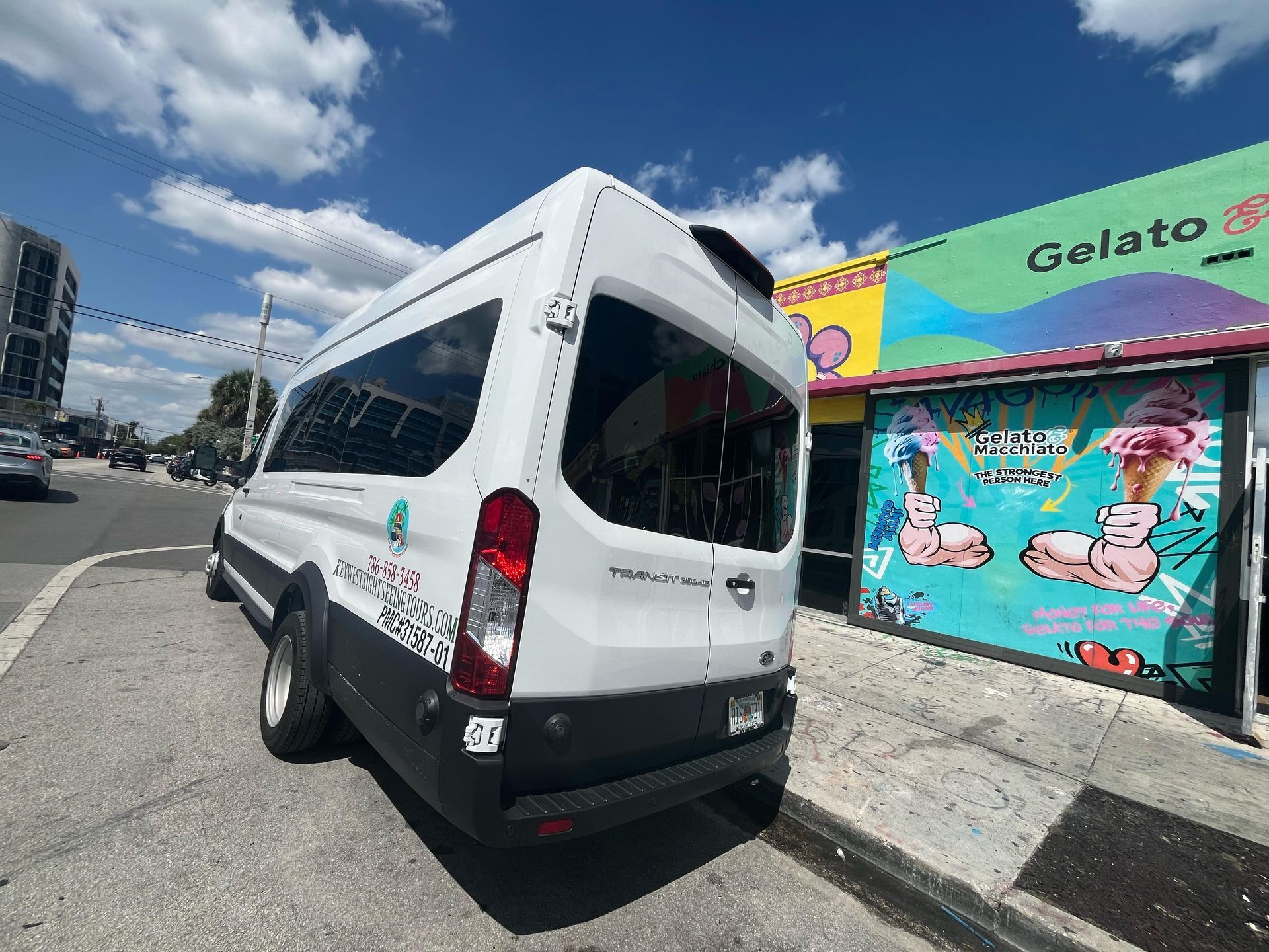 Miami Top City Tours transit van parked in Wynwood next to colorful Gelato Macchiato street art mural

