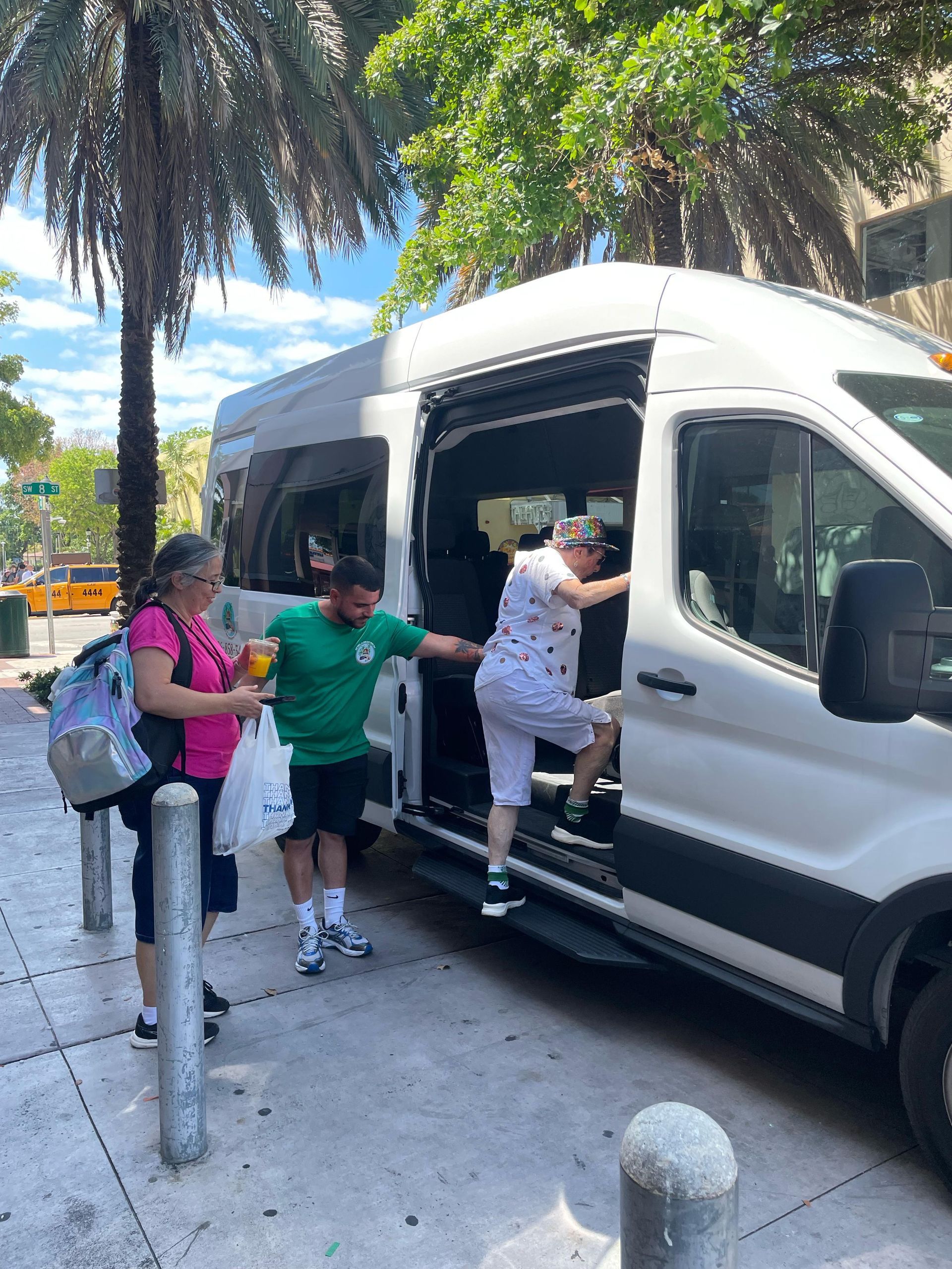 Tour guide welcoming guests onboard the Miami city tour

