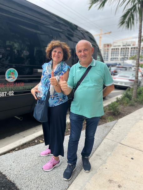 Happy passengers about to board the Miami City Sightseeing Bus 