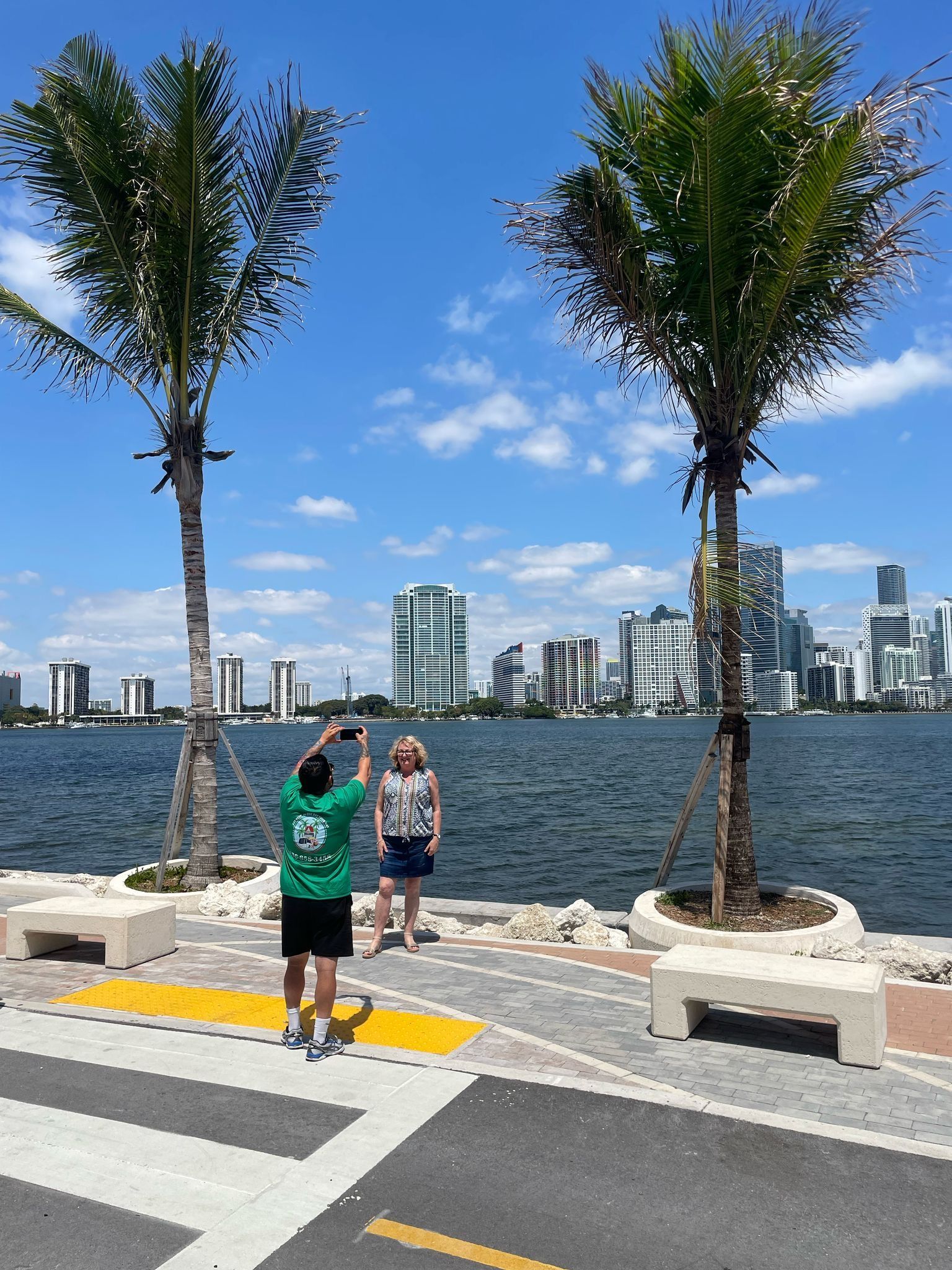 Solo passenger  posing for a photo during a guided Miami city sightseeing experience with skyline views
