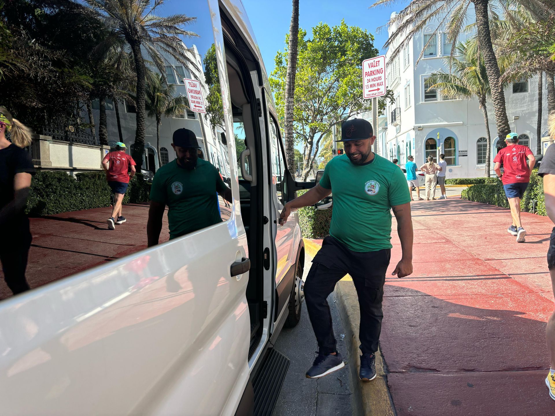Angel aka Sly Gritty meeting passengers in South Beach waiting for them to get on the Miami tour bus