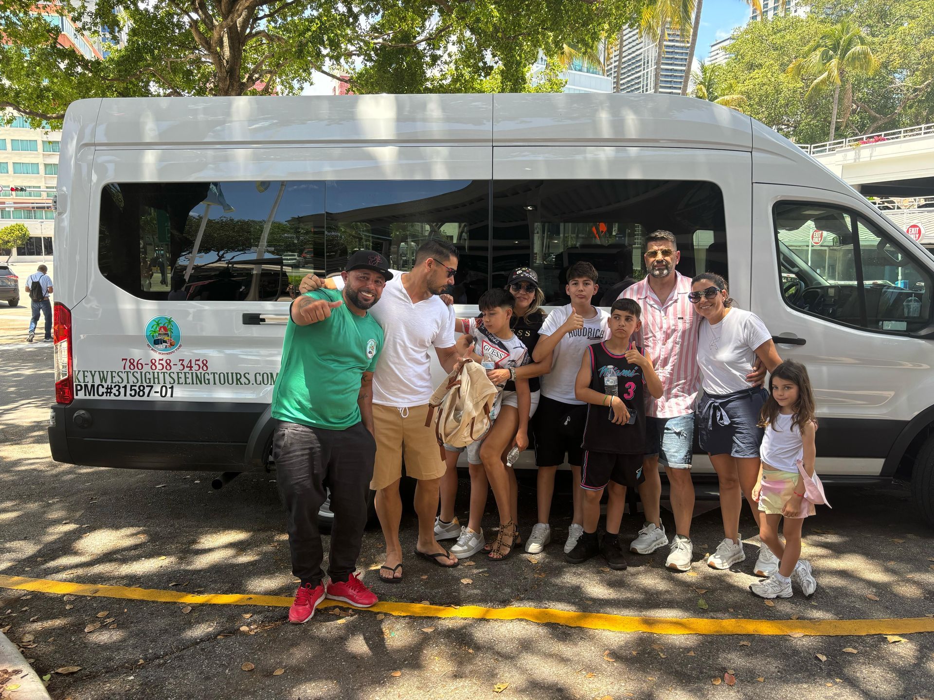 Group of Happy Guest taking Selfie with Miami Tours Bus Tour Guide Angle the Rockstars -  Aka Sly Gritty