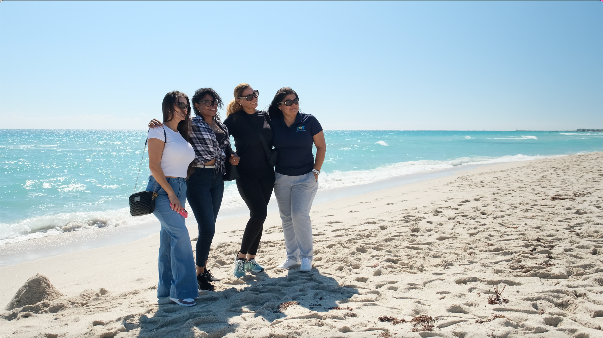 Bus Tours Miami – Tour Guide Taking Photos of Guests at South Beach