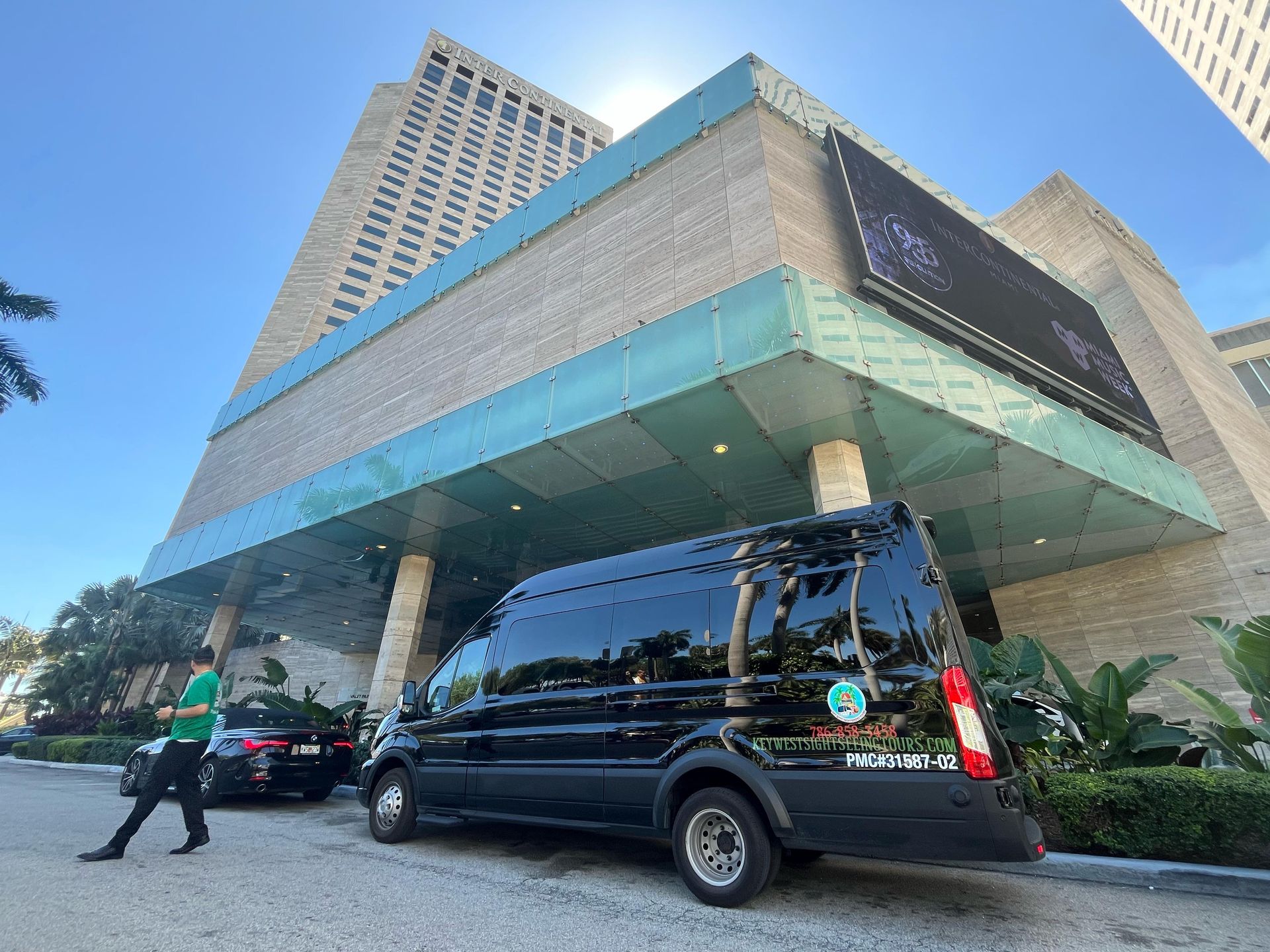 “Bus waiting at pickup point near downtown Miami”

