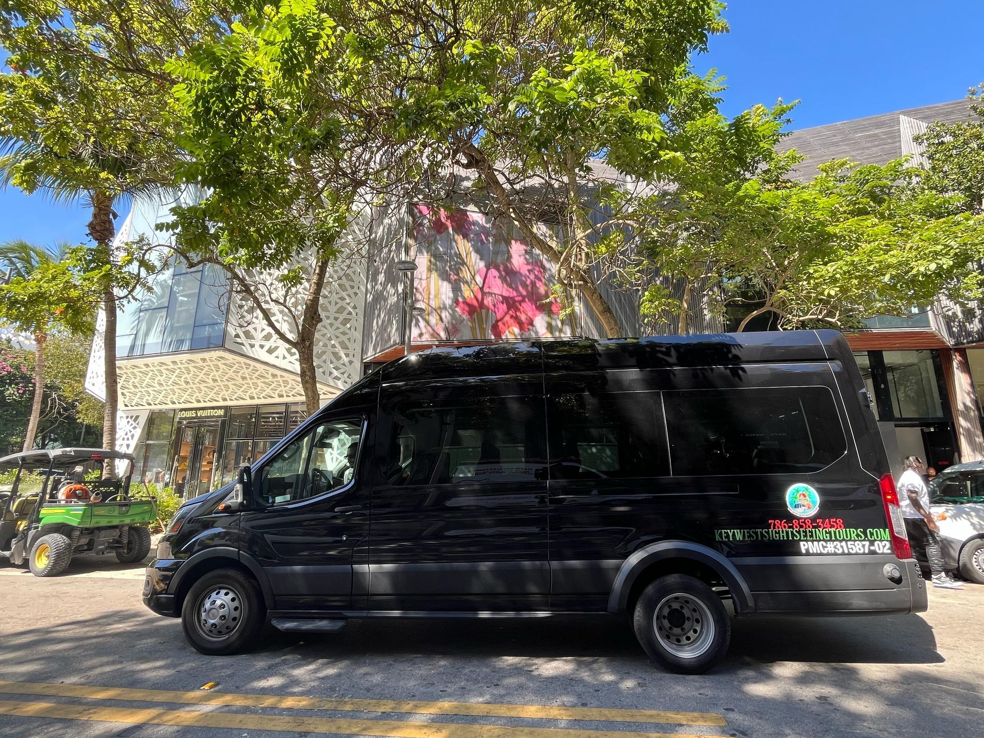 “Side view of a clean, modern Miami tour bus”
