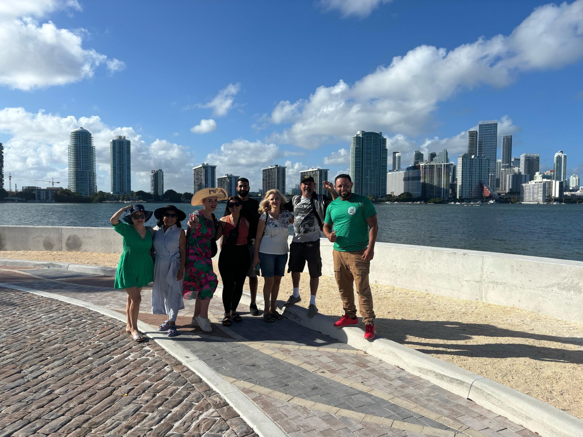 Guests at Miami skyline photo stop during hop-on hop-off sightseeing bus tour
