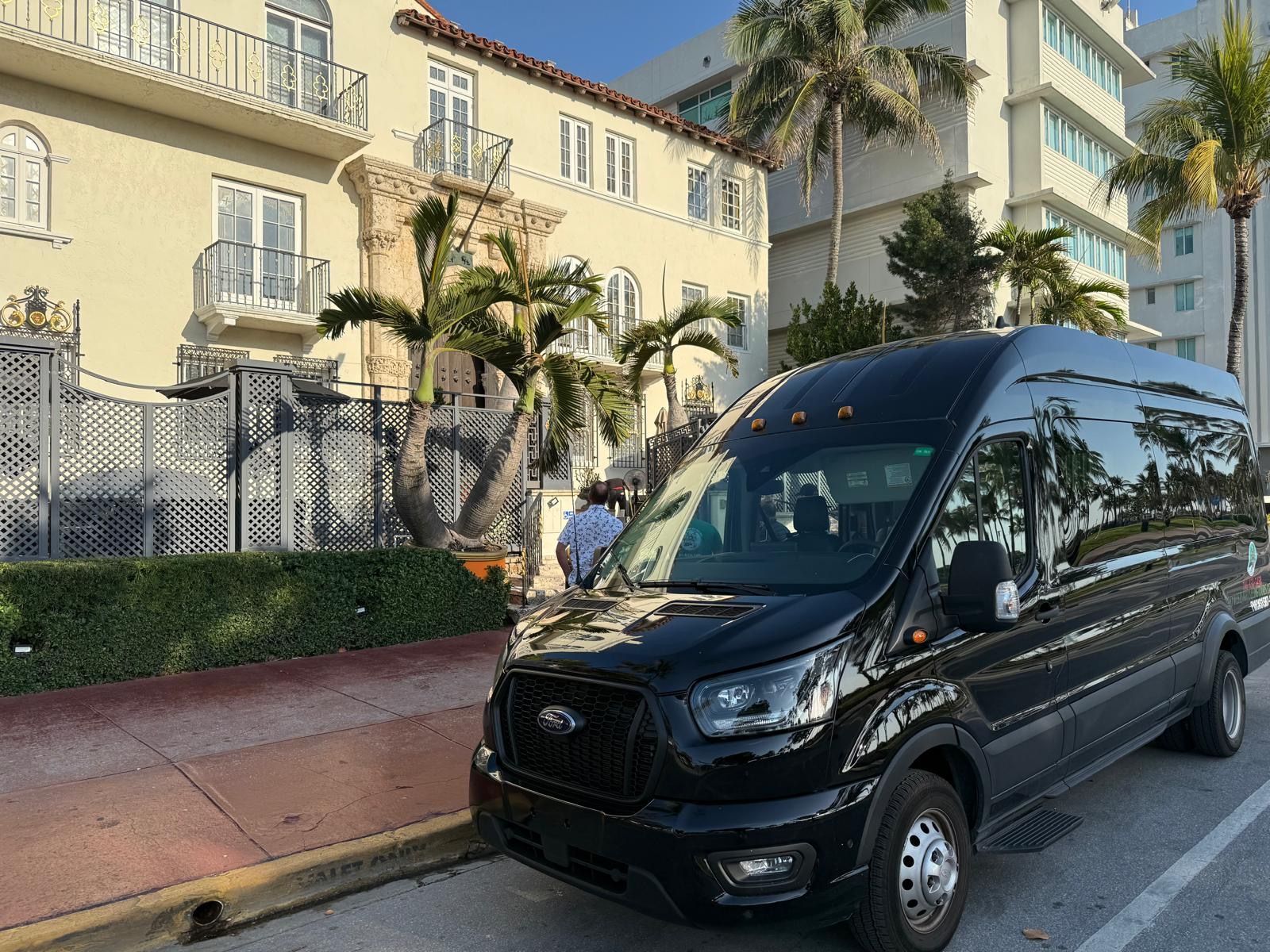 the Best City tour in Miami, the Miami tour Bus black parked in front of the Versace Mansion