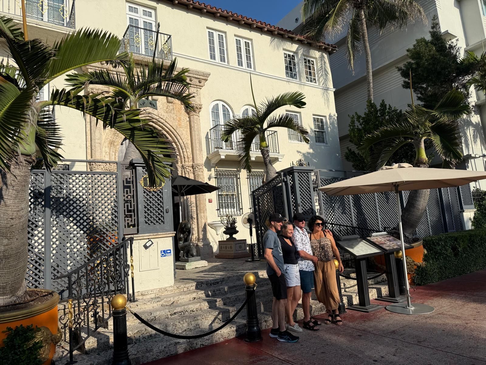 Passengers in front of the Versace Mansion part of the best City tour in Miami with Miami tour bus