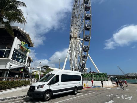 Miami Sightseeing Bus in front of the Skyviews Miami Observation Wheel at Bayside

