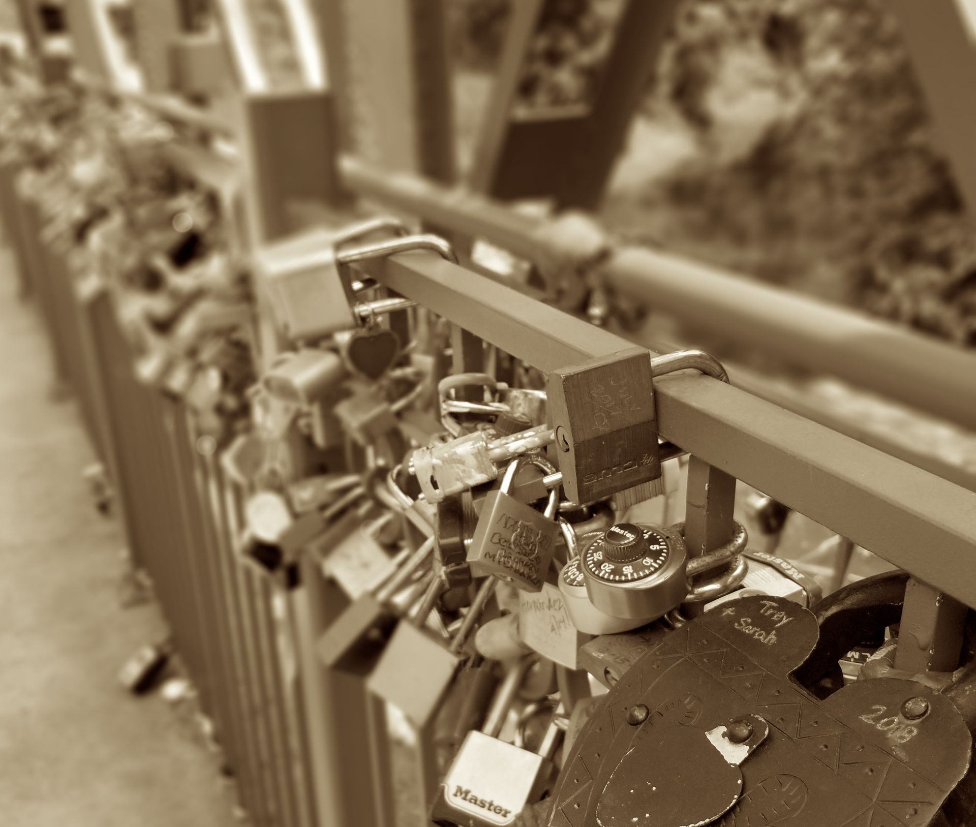 Padlocks attached to a bridge railing, symbolizing love and commitment.