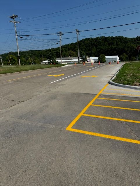 A parking lot with yellow lines painted on it