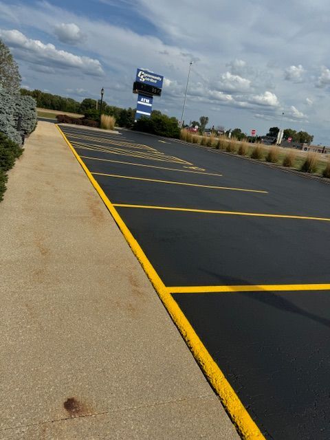 A parking lot with a sign in the background that says ' motel '