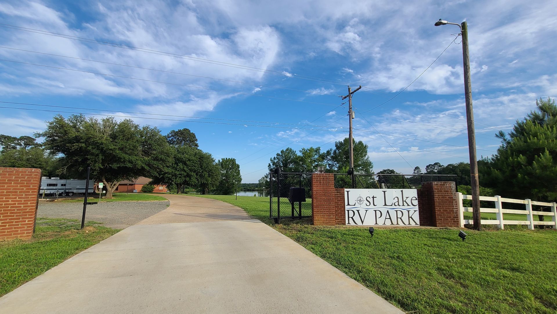A road leading to a lot like rv park