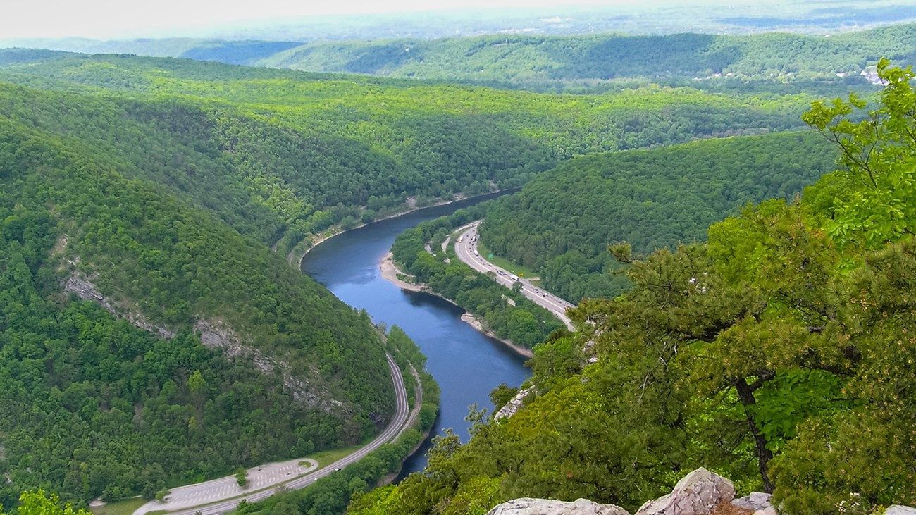 River curving through lush green mountains.