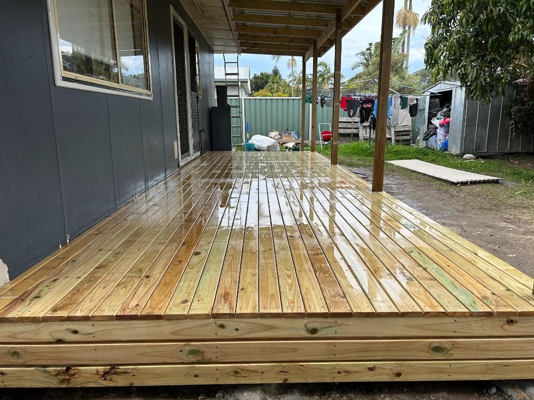 A Wooden Deck is Being Built in Front of a House — BK Build Group in Bellingen, NSW