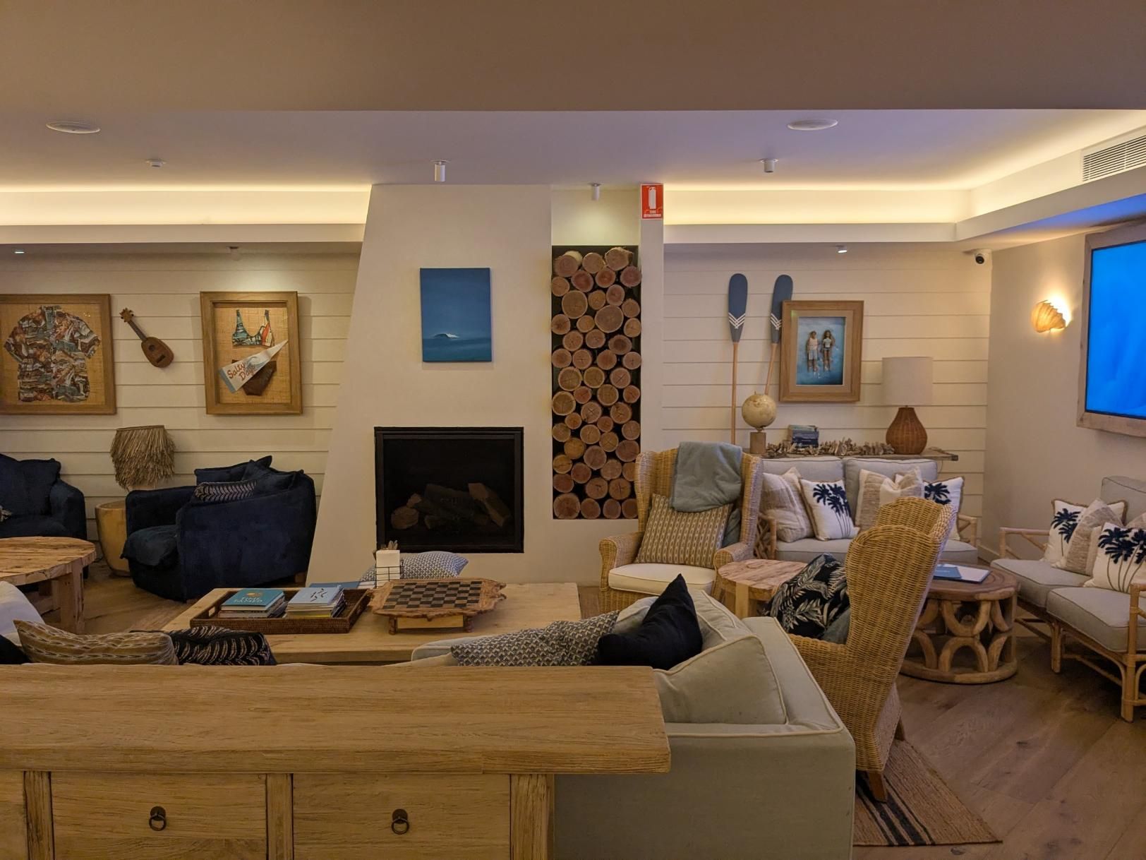 A Living Room Filled With Furniture and a Fireplace — BK Build Group in Bellingen, NSW
