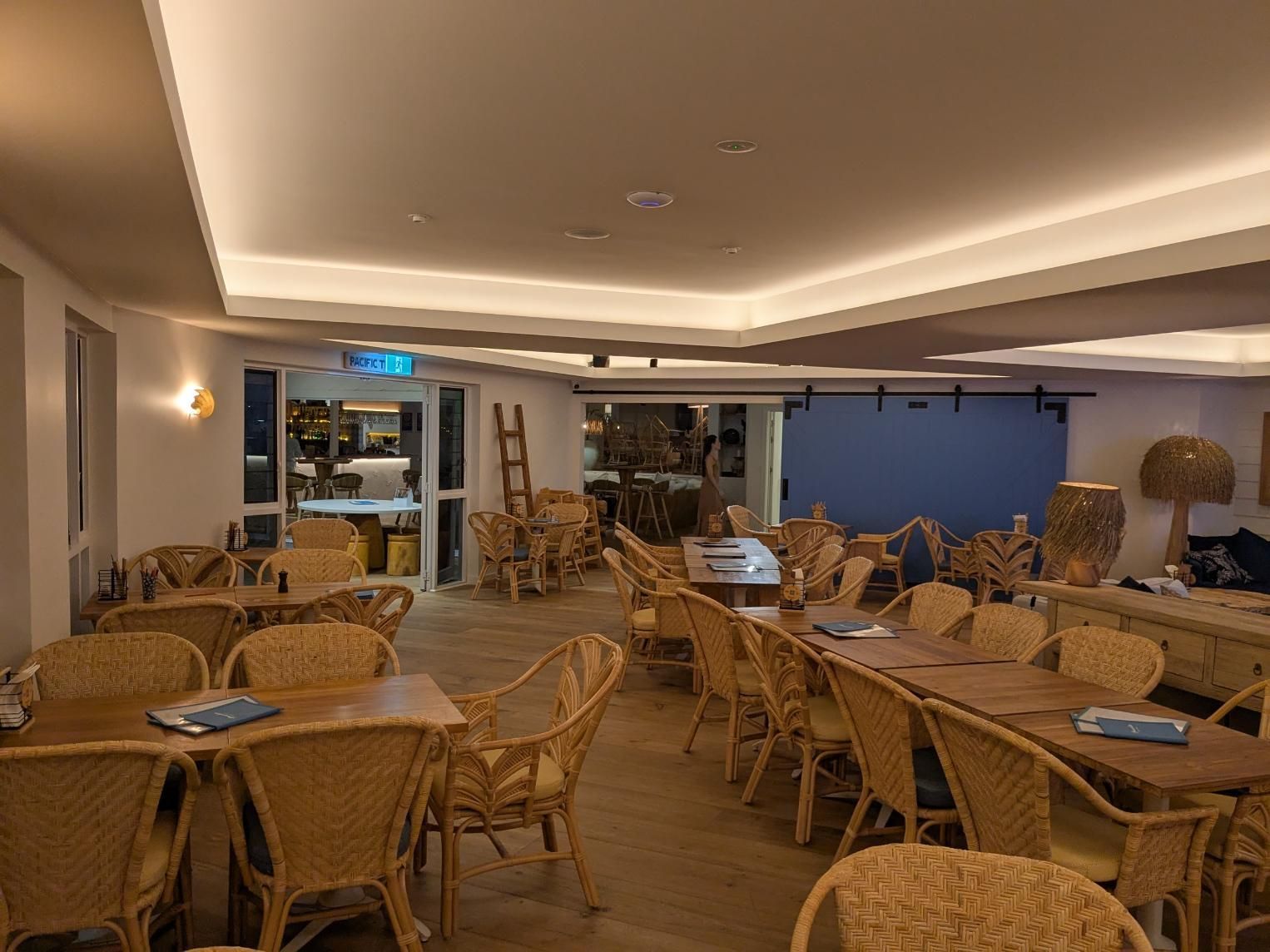 A Large Room Filled With Tables and Chairs in a Restaurant — BK Build Group in Woolgoolga, NSW