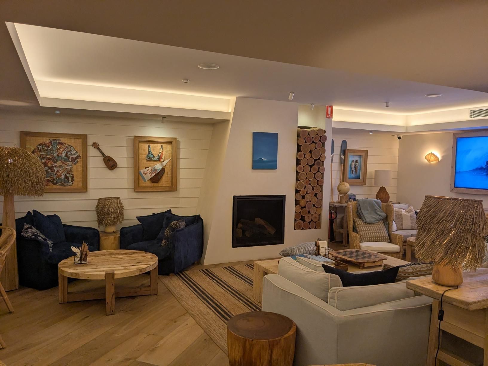 A Living Room Filled With Furniture and a Fireplace — BK Build Group in Bellingen, NSW
