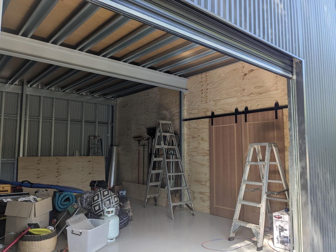 A Garage With a Ladder in the Middle of It — BK Build Group in Bellingen, NSW
