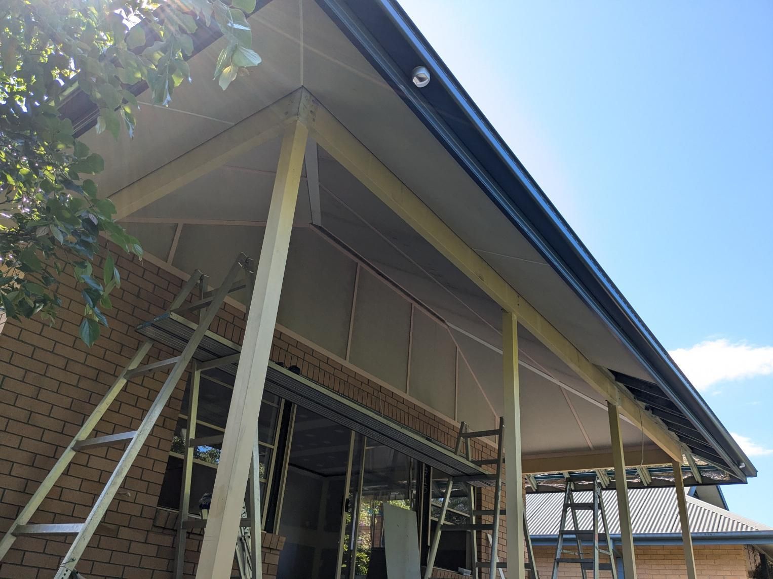 The Roof of a House is Being Built With Scaffolding — BK Build Group in Coffs Harbour, NSW