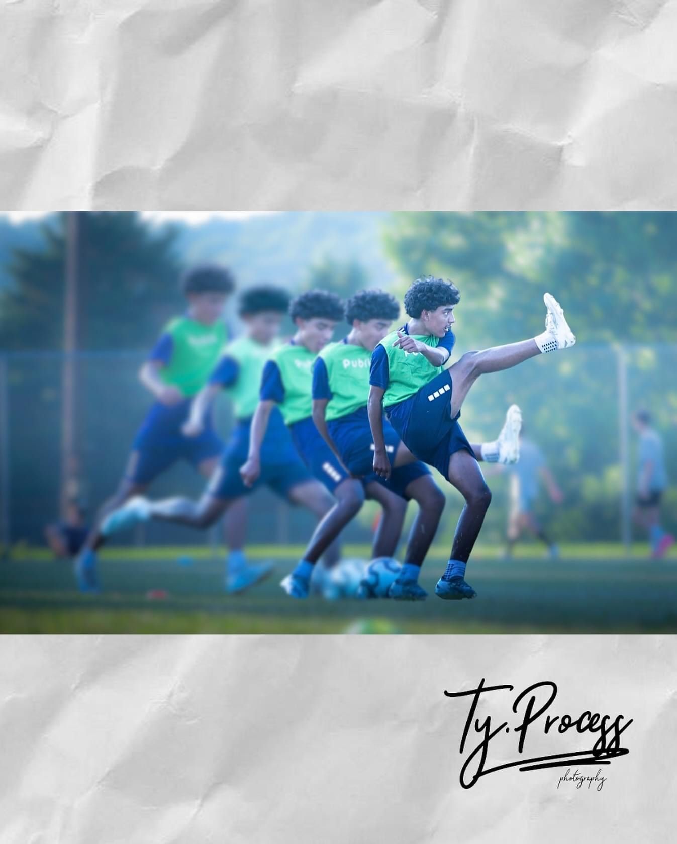 A group of young boys are playing soccer on a field.