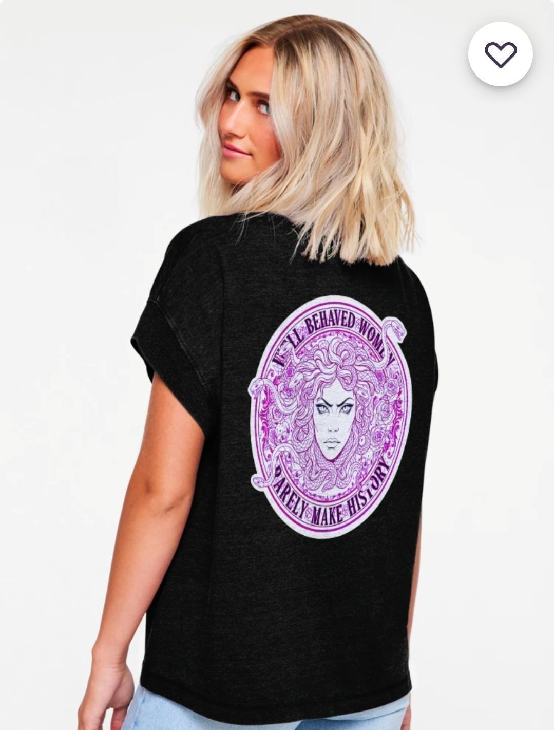 Blonde person in black T-shirt showing a purple graphic on the back, standing against a white background