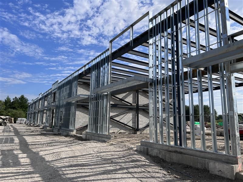 Structural engineers reviewing steel frame building design.