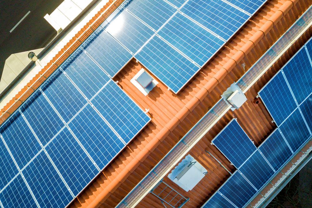 Blue Solar Panels Installed on a Red-tiled Rooftop — Goulburn Solar In Queanbeyan, NSW