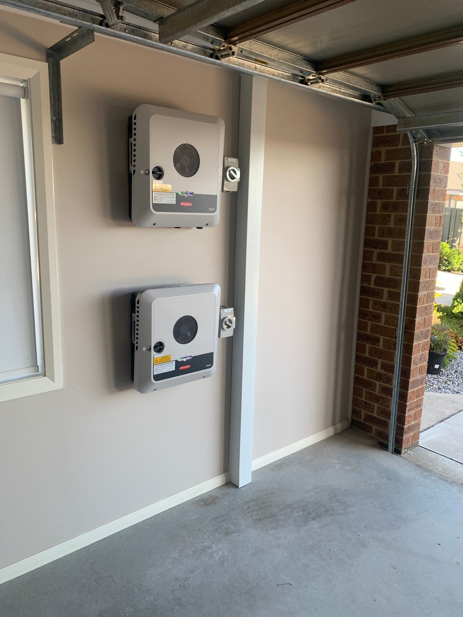 Two Inverters Inside of Garage — Goulburn Solar In Goulburn, NSW