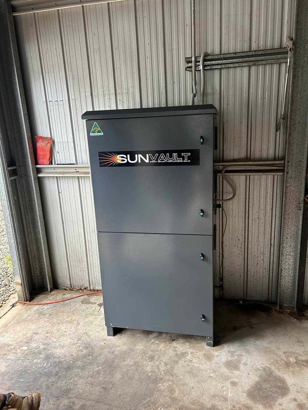 A Gray SunVault In A Garage Next To A Wall — Goulburn Solar In Goulburn, NSW