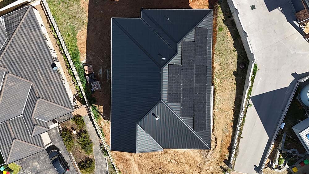 Aerial View Of A House With Solar Panels On The Roof — Goulburn Solar In Batemans Bay, NSW