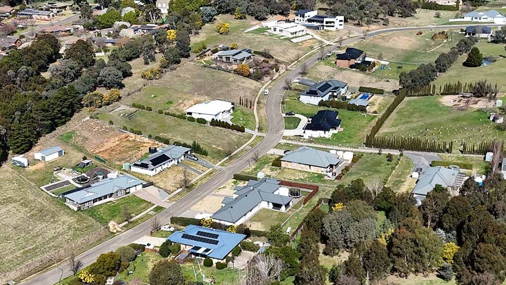 An Aerial View Of A Residential Area With Lots Of Houses And Trees — Goulburn Solar In Goulburn, NSW