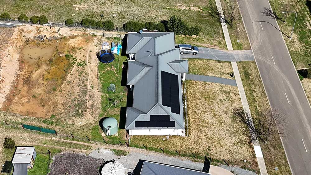 An Aerial View Of A House With Solar Panels On The Roof — Goulburn Solar In Moss Vale, NSW