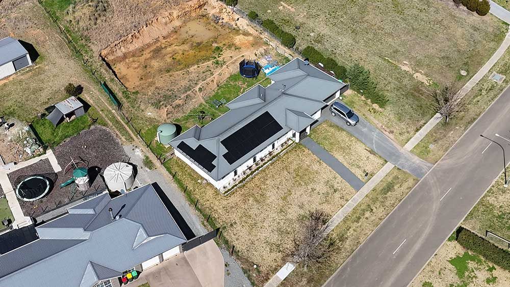 An Aerial View Of A Residential House With Solar Panels — Goulburn Solar In Goulburn, NSW