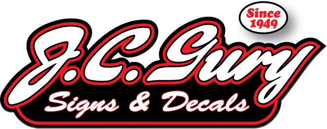 J.C. Guy Signs & Decals logo in red and black with “Since 1949” badge
