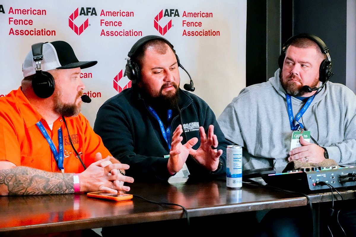 Three men wearing headphones speak at a podcast table in front of an American Fence Association backdrop.