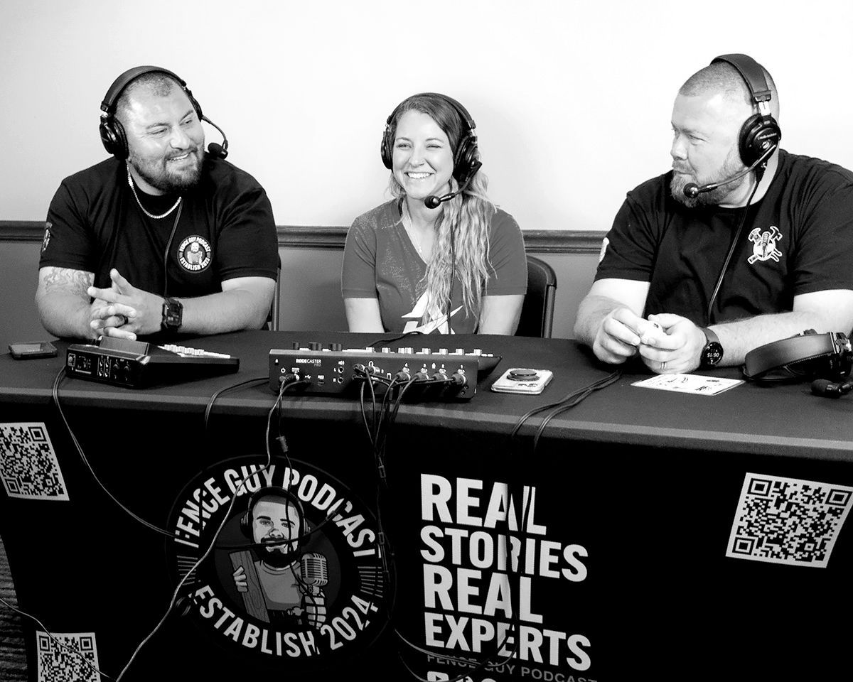 Three podcast hosts wearing headphones behind a table with microphones and “Real Stories Real Experts” banner